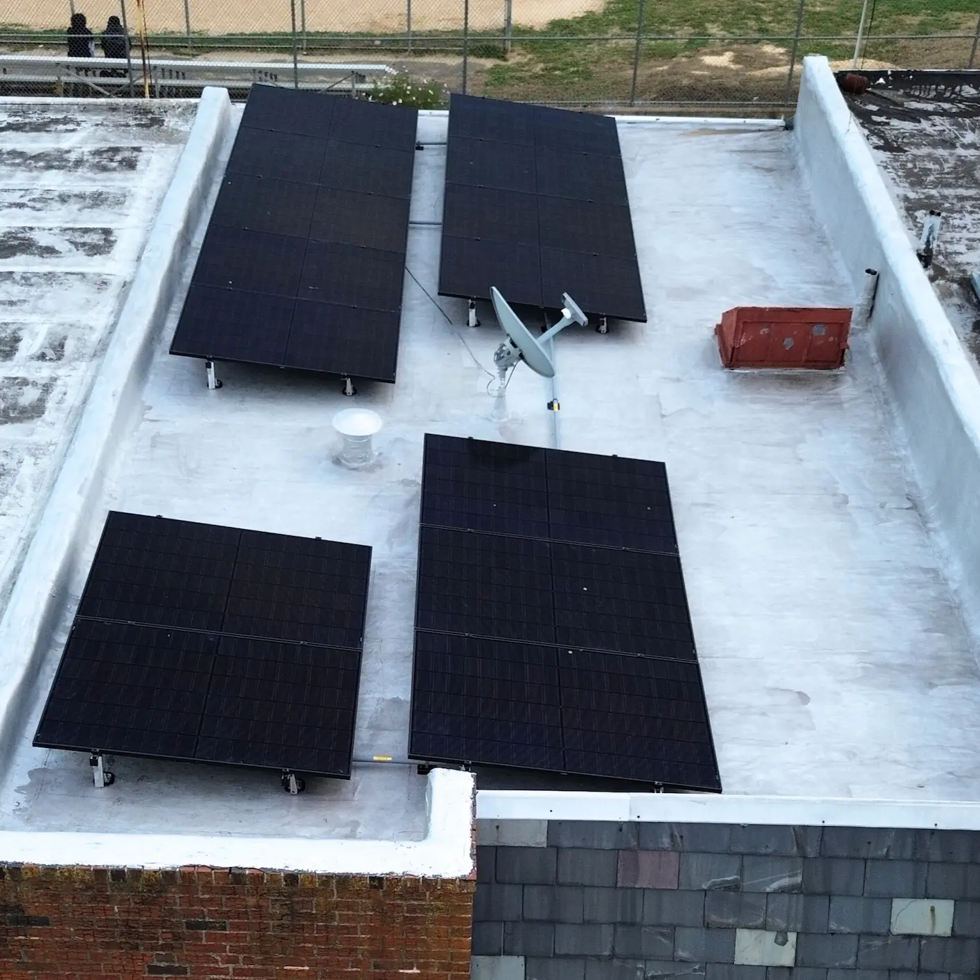 philadelphia row home town house with lifted solar panels on the new roof