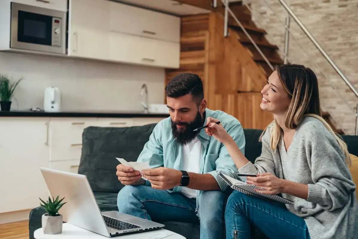 Couple looking at their finances at home