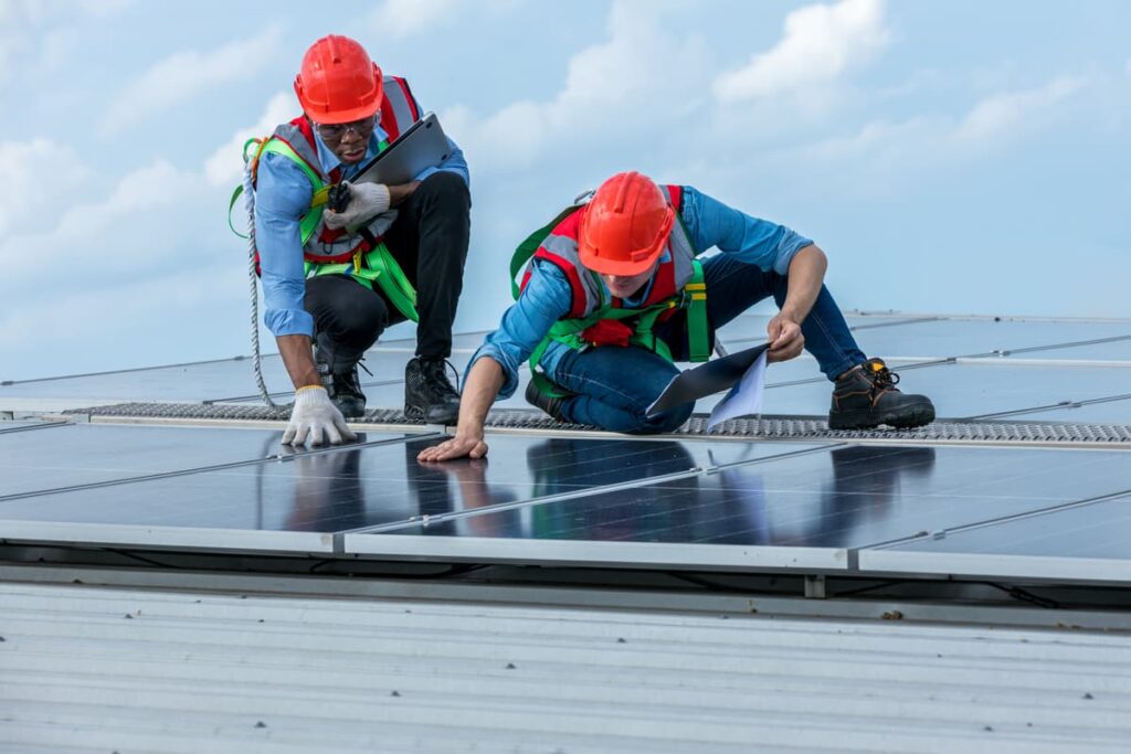 engineer-working-setup-solar-panel-at-the-roof