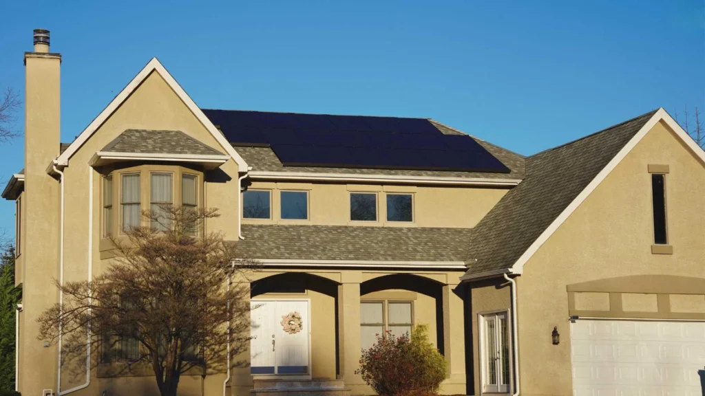 residential large house with solar panels and solar skirt on roof
