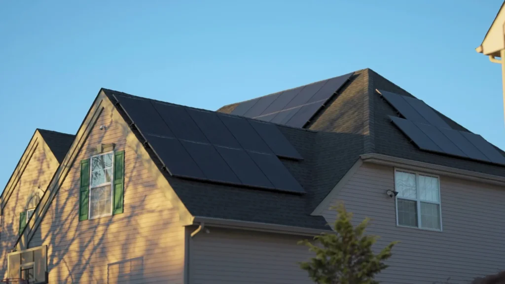 home with panels on garage sleek all black solar panels