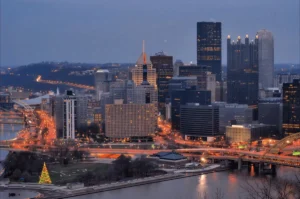 Pittsburgh skyline with utility transmission infrastructure in Duquesne Light service territory