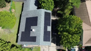 Aerial view of residential house with solar panel installation