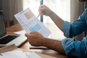 Person reviewing utility bill document